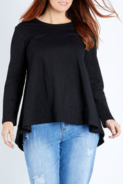 Model Laura wearing size 12 of The Long Sleeve Swing Tee in colour Black (Black), from the front, cropped image