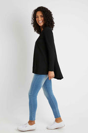 Model Pamela wearing size 10 of The Long Sleeve Swing Tee in colour Black (Black), from the front, showing the whole outfit