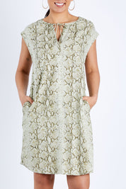 Model Pamela wearing size 10 of The Button Up Snake Shift in colour Khaki (Green), from the front, cropped image