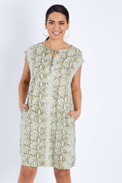 Model Pamela wearing size 10 of The Button Up Snake Shift in colour Khaki (Green), from the front, cropped image