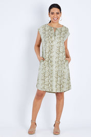 Model Pamela wearing size 10 of The Button Up Snake Shift in colour Khaki (Green), from the front, showing the whole outfit