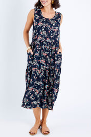 Model Andrea wearing size 10 of The Print Layered Maxi in colour Navyprint (Blue), from the front, cropped image