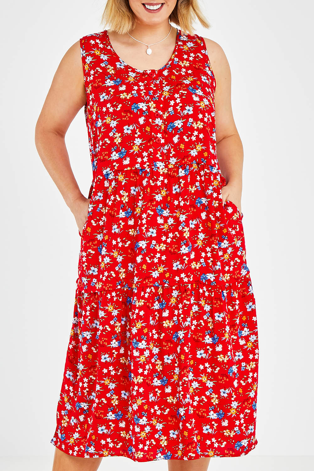 Model Jess wearing size 14 of The Print Layered Maxi in colour Redfloral (Red), from the front, cropped image