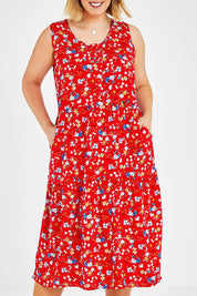 Model Jess wearing size 14 of The Print Layered Maxi in colour Redfloral (Red), from the front, cropped image
