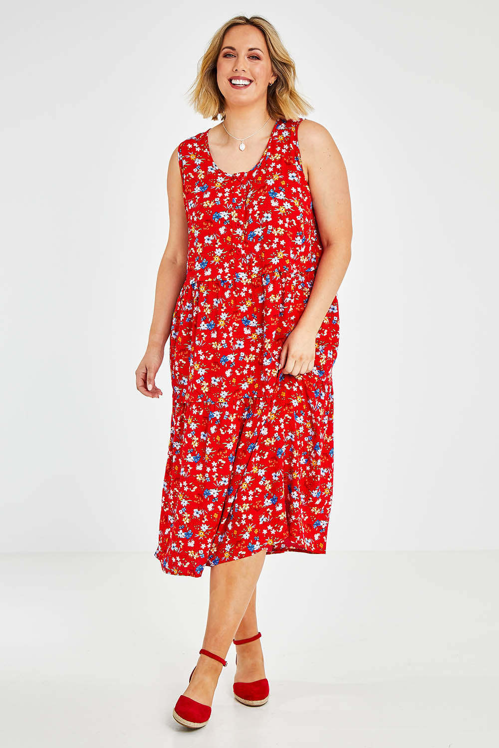 Model Jess wearing size 14 of The Print Layered Maxi in colour Redfloral (Red), from the front, showing the whole outfit