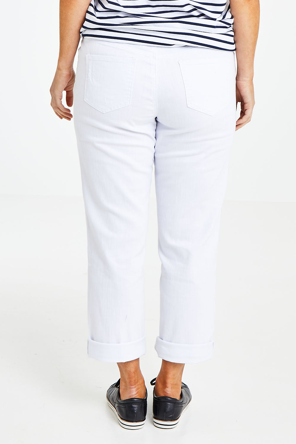 Model Laura wearing size 14 of The Boyfriend Jean in colour White (White), from the back