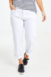 Model Laura wearing size 14 of The Boyfriend Jean in colour White (White), from the front, cropped image