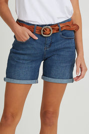 Model Madeline wearing size 10 of The 5 Pocket Denim Short in colour Dkdenim (Blue), from the front, cropped image