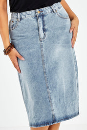 Model Sasha-Lee wearing size 16 of The Midi Denim Skirt in colour Denim (Blue), from the front, cropped image