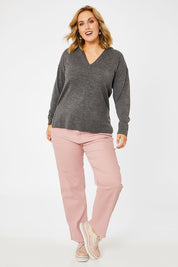Model Jess wearing size L of The Hoody Knit Jumper in colour Charcoal (Grey), from the front, showing the whole outfit