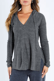 Model Kimberley wearing size S of The Hoody Knit Jumper in colour Charcoal (Grey), from the front, cropped image