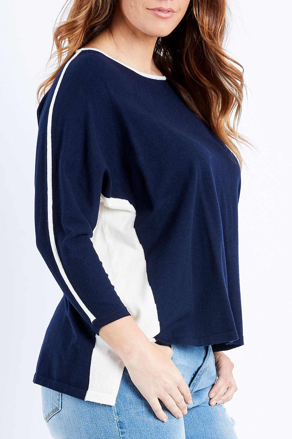 Model Laura wearing size L of The 2 Tone Jumper in colour Navy (Blue), from the front, cropped image