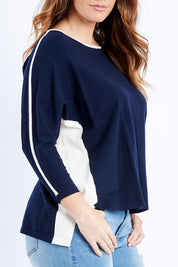 Model Laura wearing size L of The 2 Tone Jumper in colour Navy (Blue), from the front, cropped image