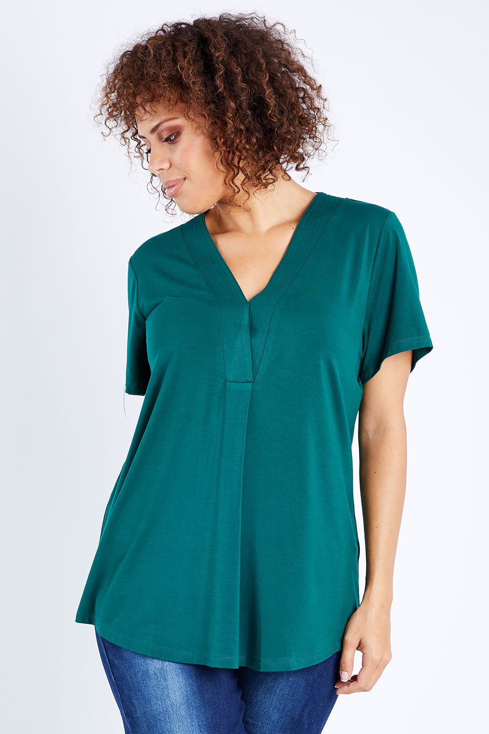 Model Lala wearing size 10 of The Stitch Detail Short Sleeve Top in colour Pinegreen (Green), from the front, cropped image