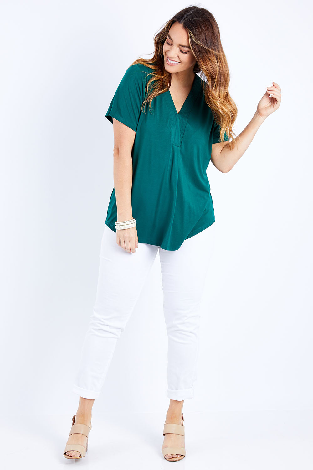 Model Laura wearing size 14 of The Stitch Detail Short Sleeve Top in colour Pinegreen (Green), from the front, showing the whole outfit