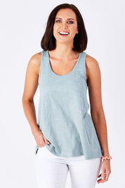 Model Perrie wearing size 10 of The Pull On Short in colour White (White), from the front, cropped image