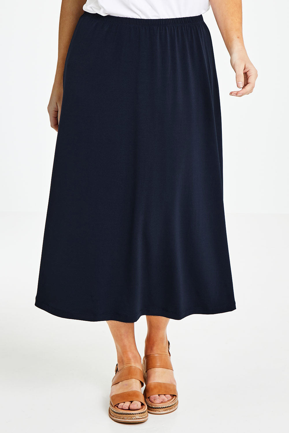 Model Laura wearing size 14 of The Recycled Pull On Skirt in colour Navy (Blue), from the front, cropped image