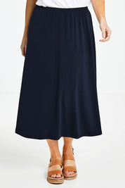 Model Laura wearing size 14 of The Recycled Pull On Skirt in colour Navy (Blue), from the front, cropped image