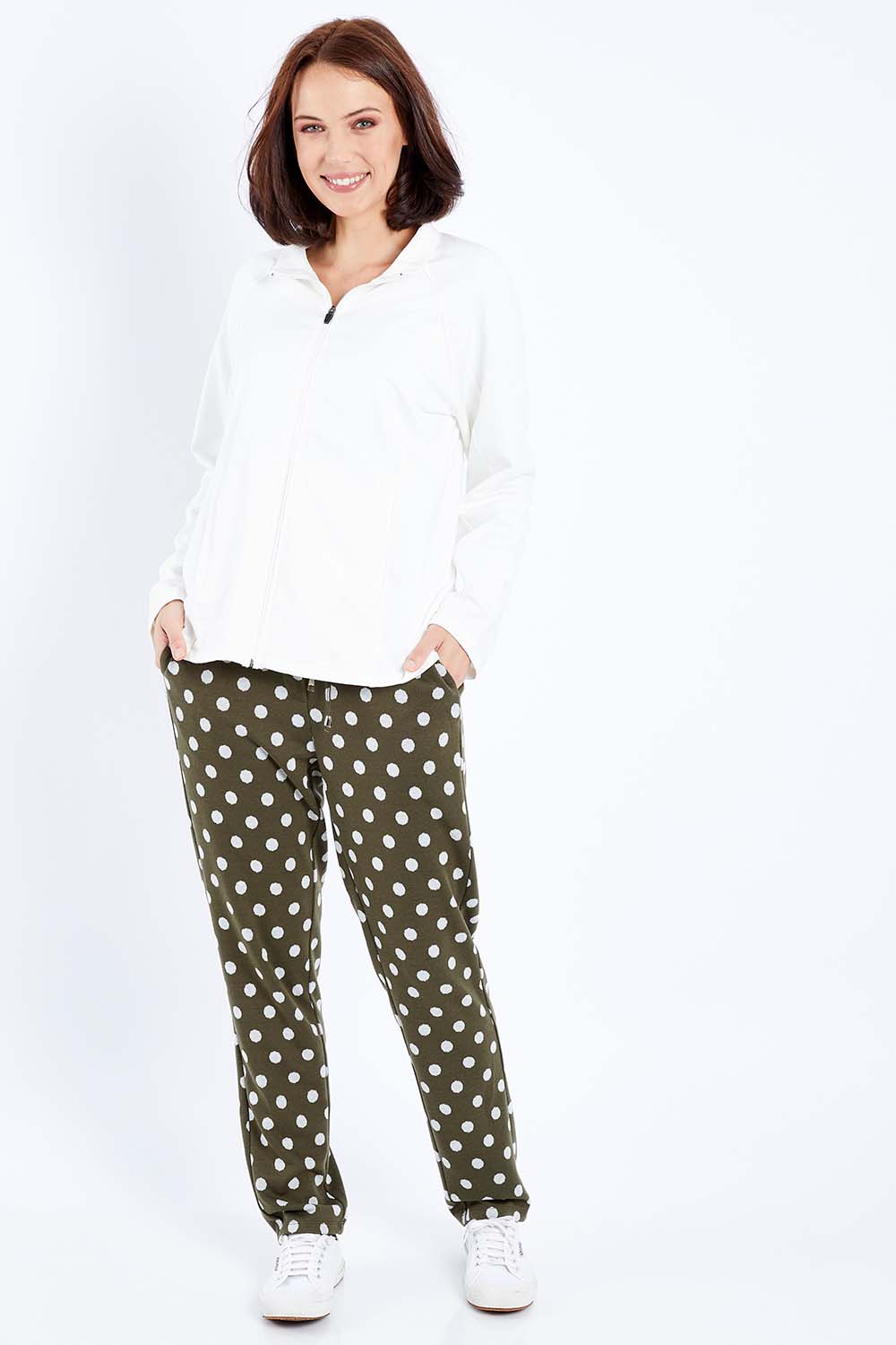 Model Andrea wearing size 10 of The Spot Jacquard Pull On Pant in colour Khakispot (Green), from the front, showing the whole outfit