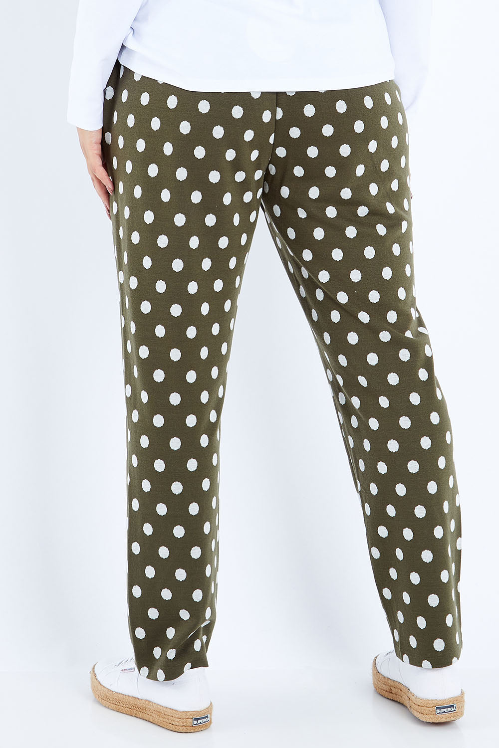 Model Sasha-Lee wearing size 16 of The Spot Jacquard Pull On Pant in colour Khakispot (Green), from the back