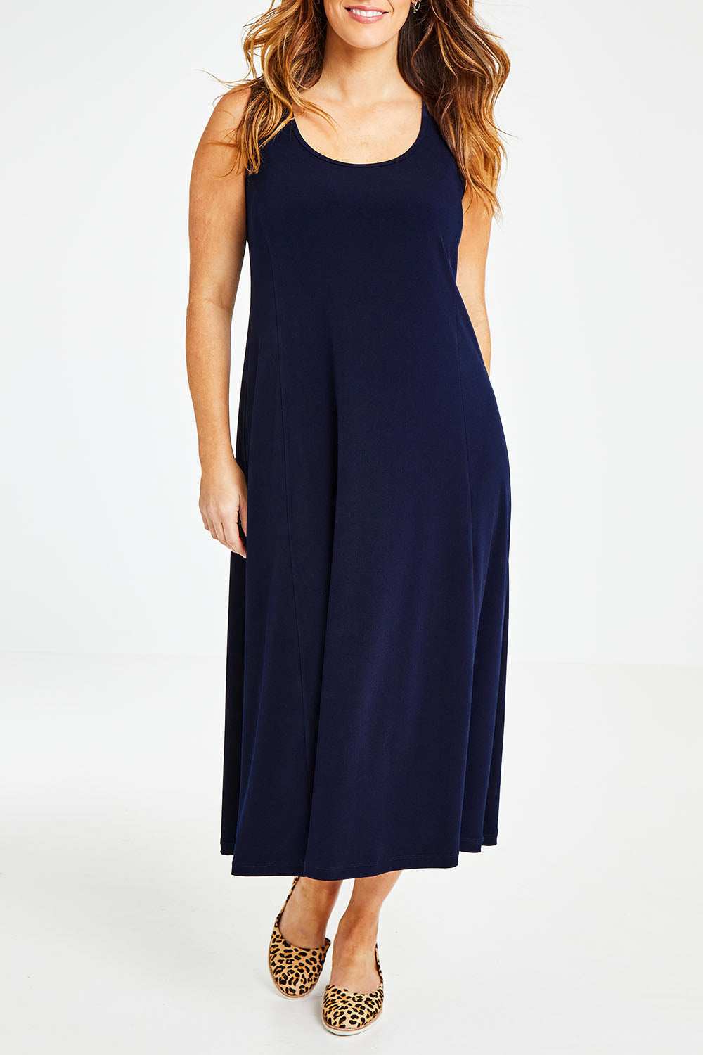 Model Laura wearing size 14 of The Recycled A Line Midi Dress in colour Navy (Blue), from the front, cropped image