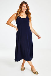Model Laura wearing size 14 of The Recycled A Line Midi Dress in colour Navy (Blue), from the front, showing the whole outfit