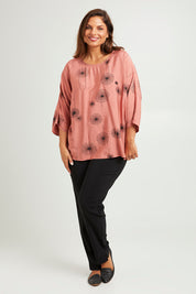 Model Monique wearing size 14 of The Relax Fit Printed Top in colour Rosecopper (Pink), from the front, showing the whole outfit