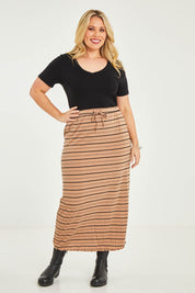 Model Katie wearing size 16 of The Pull On Maxi Skirt in colour Camelblack (Black), from the front, showing the whole outfit