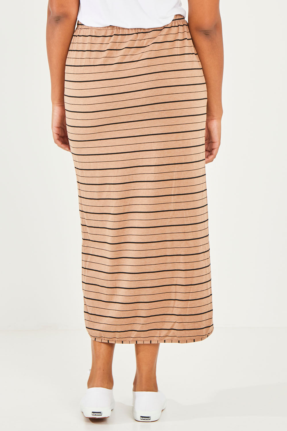 Model Noli wearing size 14 of The Pull On Maxi Skirt in colour Camelblack (Black), from the back