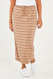 Model Noli wearing size 14 of The Pull On Maxi Skirt in colour Camelblack (Black), from the front, cropped image