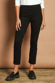 Model Madeline wearing size 10 of The Straight Leg Ponte Pant in colour Black (Black), from the front, cropped image
