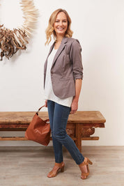 Model Alex wearing size 8 of The Everyday Jegging in colour Denim (Blue), from the front, showing the whole outfit