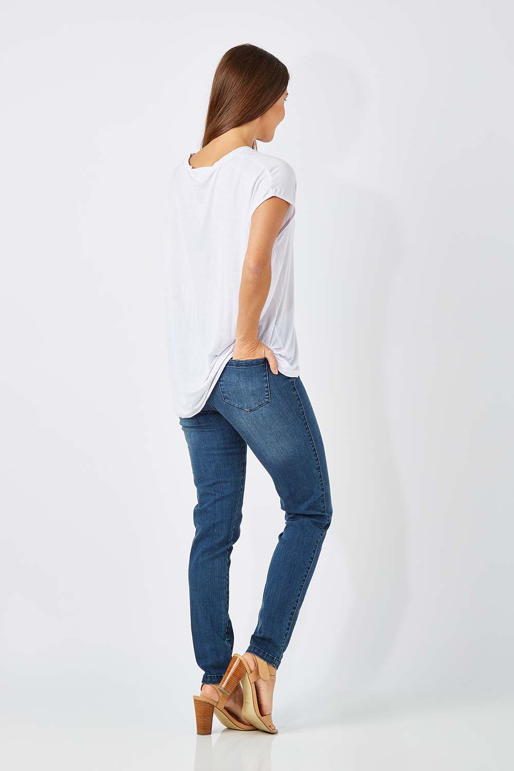 Model Anna wearing size 10 of The Everyday Jegging in colour Denim (Blue), from the back