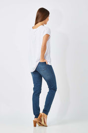 Model Anna wearing size 10 of The Everyday Jegging in colour Denim (Blue), from the back