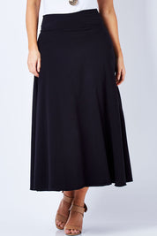 Model Laura wearing size 12 of The Best Seller Skirt in colour JetBlack (Black), from the front, cropped image