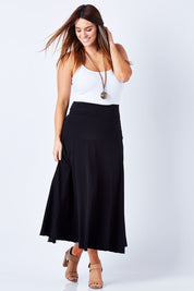 Model Laura wearing size 12 of The Best Seller Skirt in colour JetBlack (Black), from the front, showing the whole outfit