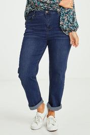 Model Laura wearing size 14 of the Preloved The Keepers Highwaisted Straight Jean in colour Darkdenim (Blue), from the front, cropped image