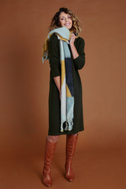 Model Emma wearing size S of The Everyday Knit Midi Dress in colour Deepkhaki (Green), from the front, showing the whole outfit