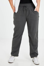 Model Jess wearing size 14 of The Easy Wear Pant in colour Ashgreen (Green), from the front, cropped image