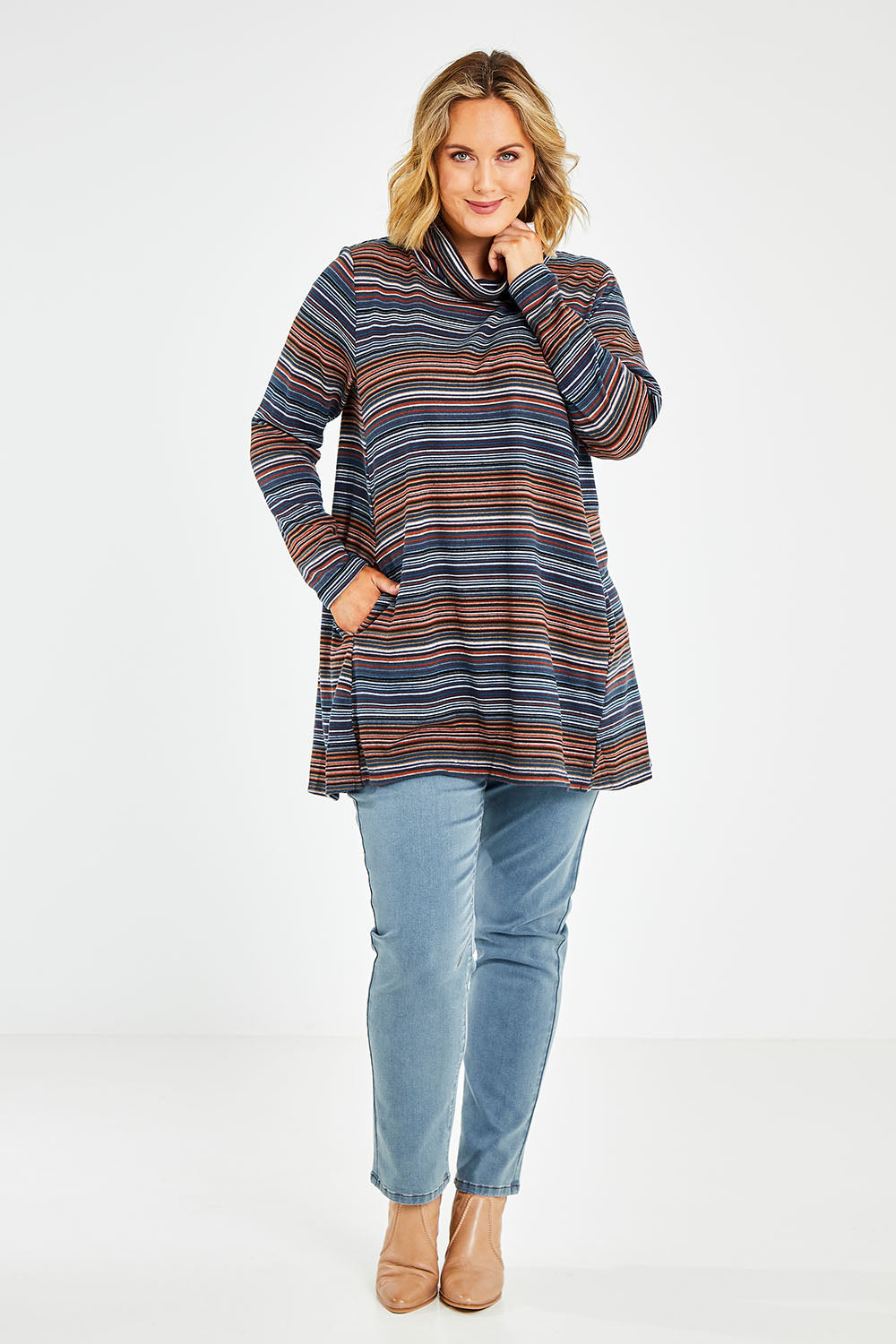 Model Jess wearing size 14 of The Striped Light Knit Tunic in colour Bluestripe (Blue), from the front, showing the whole outfit
