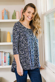 Model Tahlia wearing size 10 of The Printed Jersey 3/4 Sleeve Swing Tee in colour Multispot (Blue), from the front, showing the whole outfit