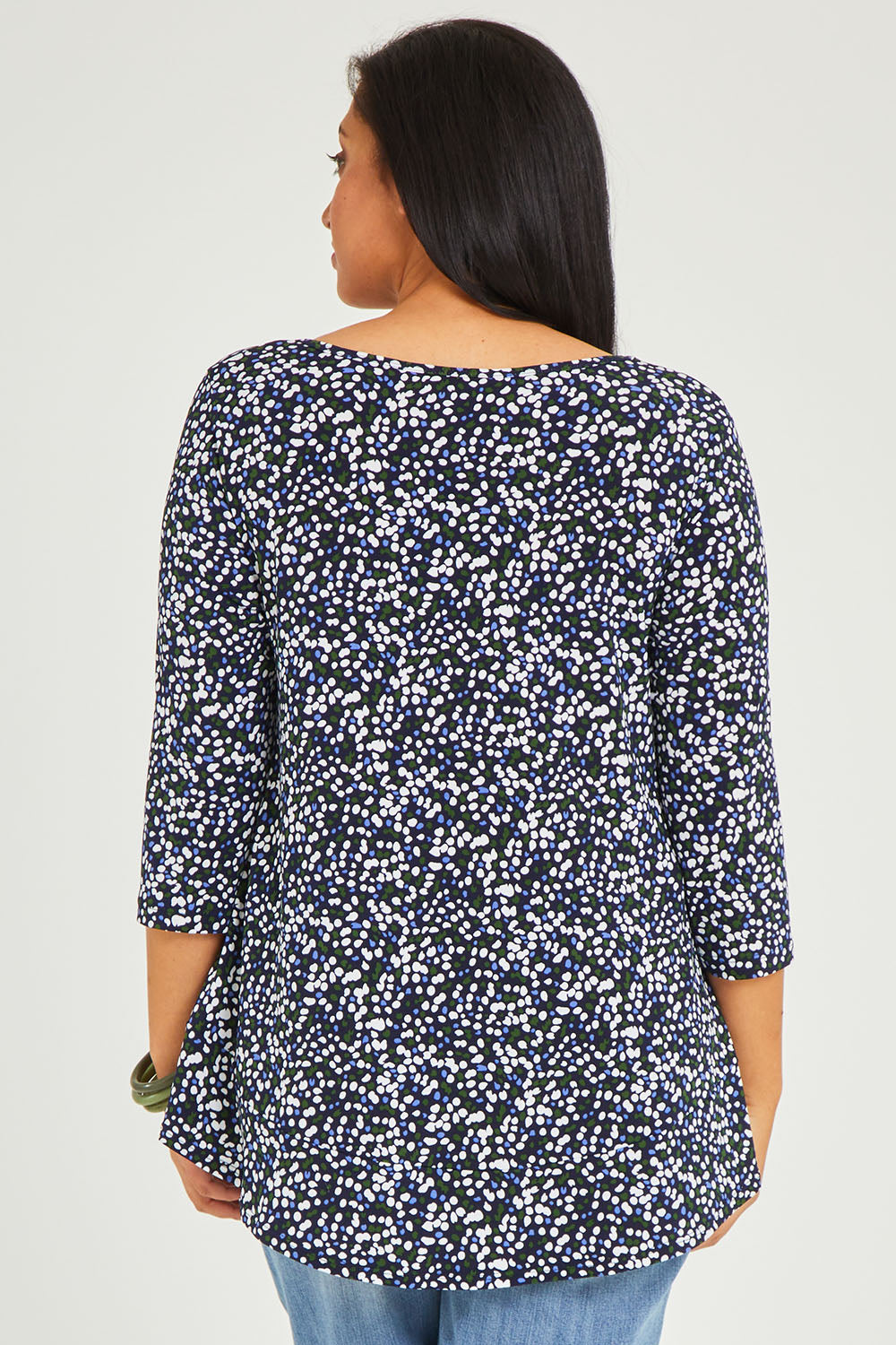 Model Terri-Leigh wearing size 14 of The Printed Jersey 3/4 Sleeve Swing Tee in colour Multispot (Blue), from the back