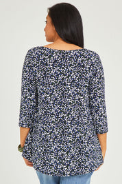 Model Terri-Leigh wearing size 14 of The Printed Jersey 3/4 Sleeve Swing Tee in colour Multispot (Blue), from the back