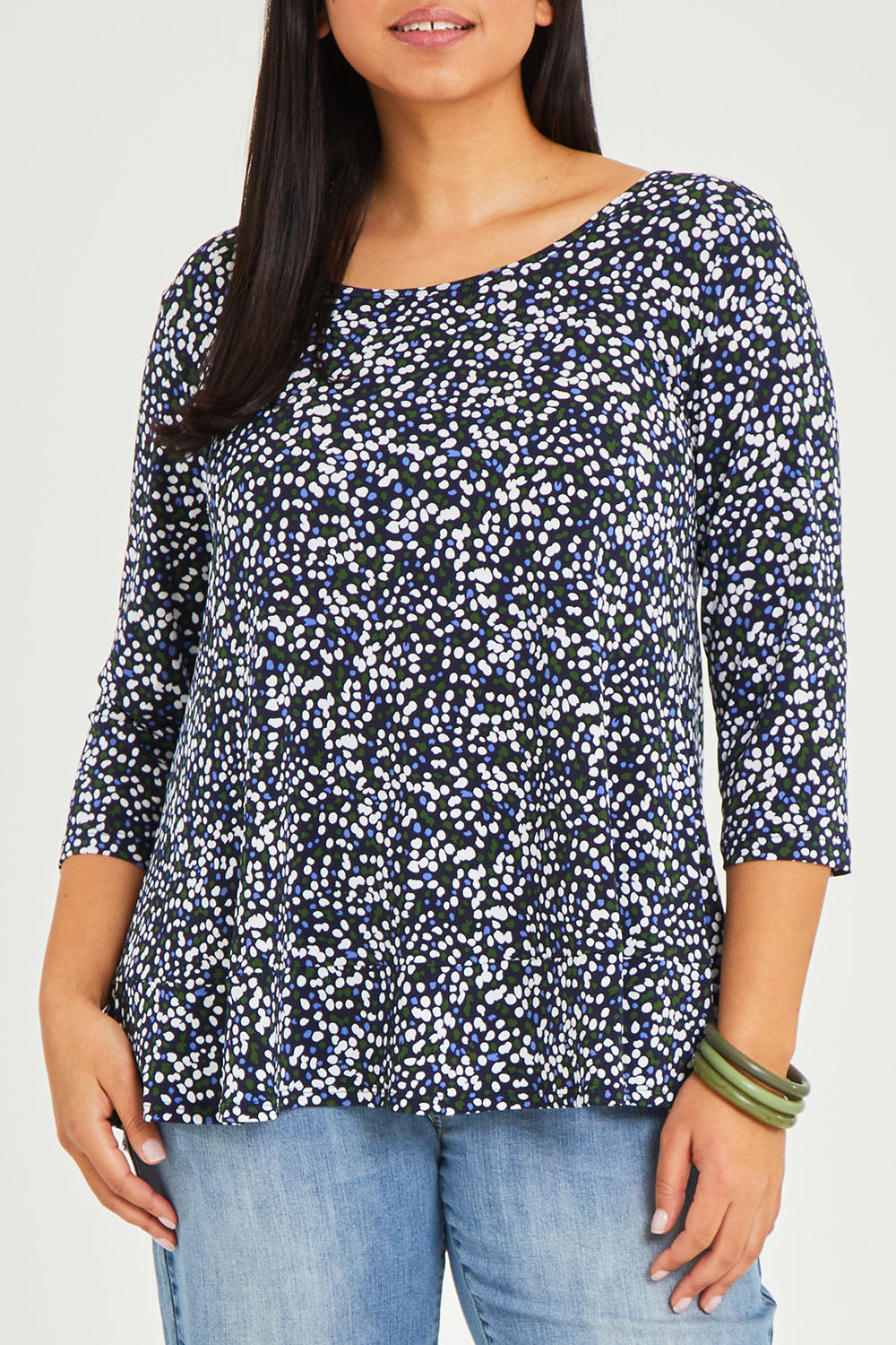 Model Terri-Leigh wearing size 14 of The Printed Jersey 3/4 Sleeve Swing Tee in colour Multispot (Blue), from the front, cropped image