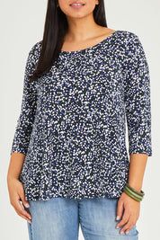 Model Terri-Leigh wearing size 14 of The Printed Jersey 3/4 Sleeve Swing Tee in colour Multispot (Blue), from the front, cropped image