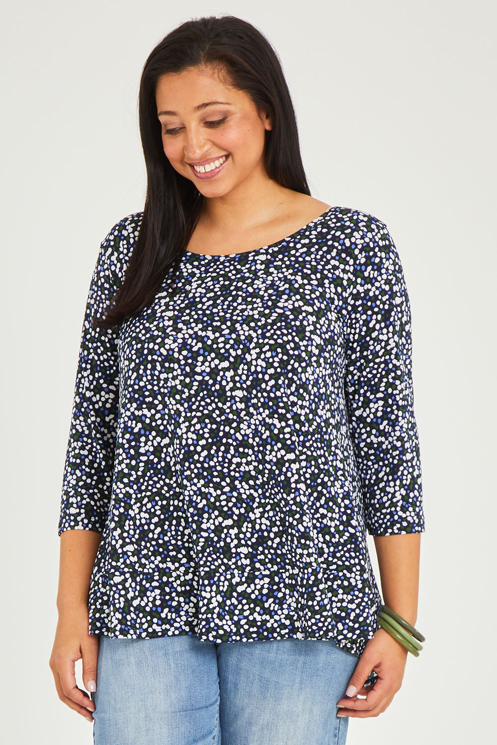 Model Terri-Leigh wearing size 14 of The Printed Jersey 3/4 Sleeve Swing Tee in colour Multispot (Blue), from the front, cropped image