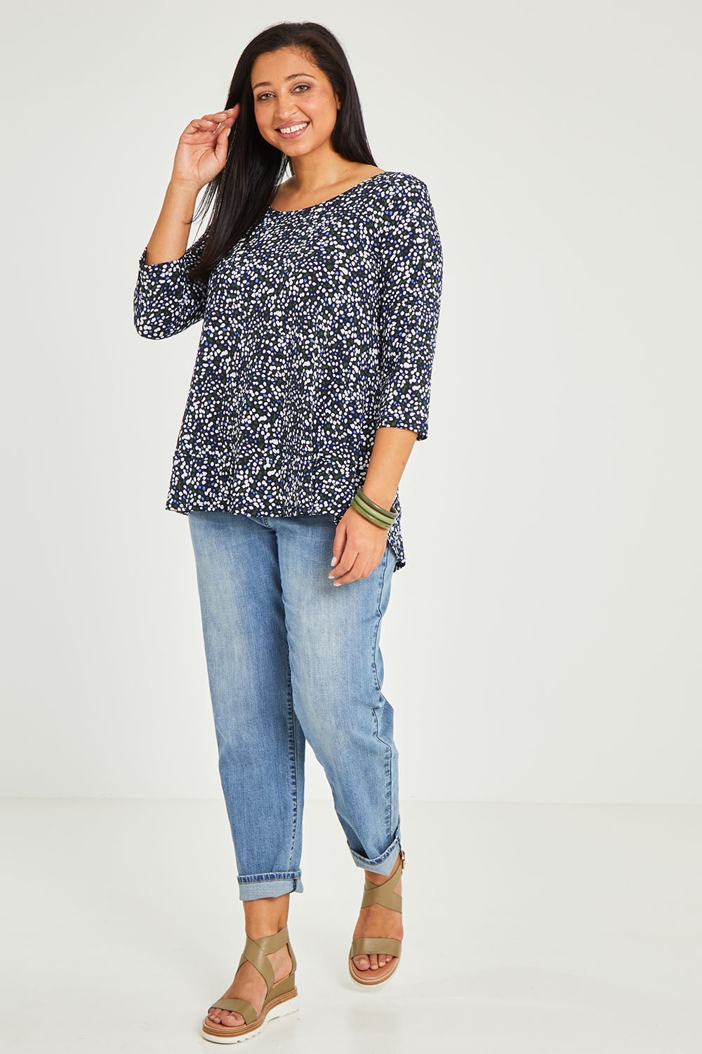 Model Terri-Leigh wearing size 14 of The Printed Jersey 3/4 Sleeve Swing Tee in colour Multispot (Blue), from the front, showing the whole outfit