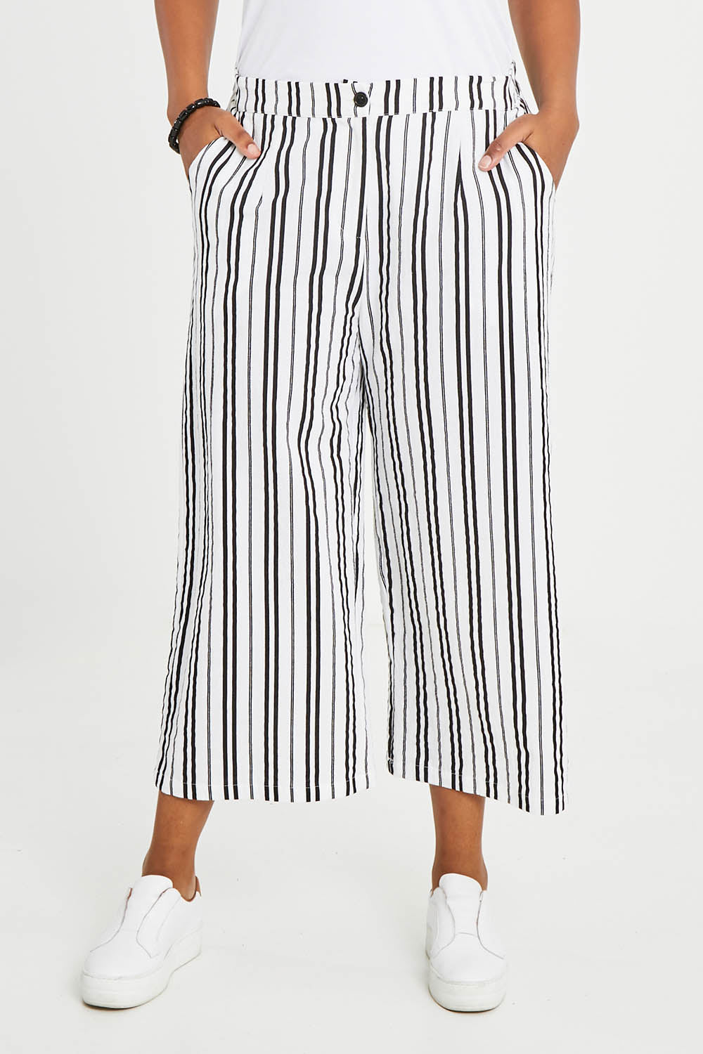 Model Noli wearing size 14 of The Striped Pull On Cullotte in colour Blackwhite (Black), from the front, cropped image