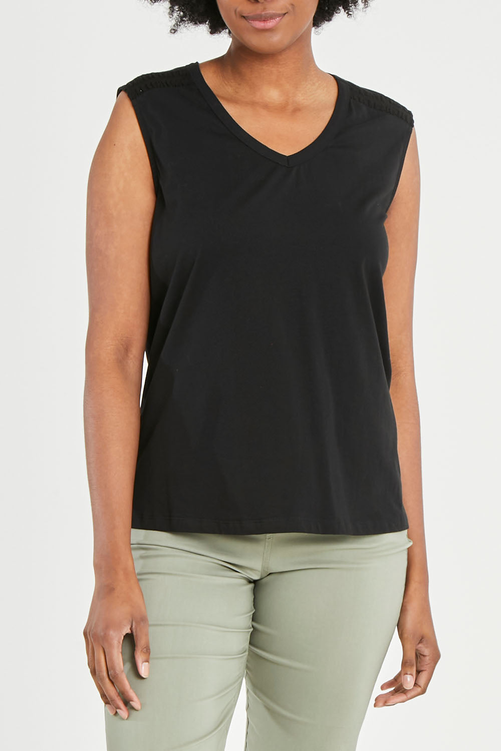 Model Aiyana wearing size 10 of The Lace Insert Tank in colour Black (Black), from the front, cropped image