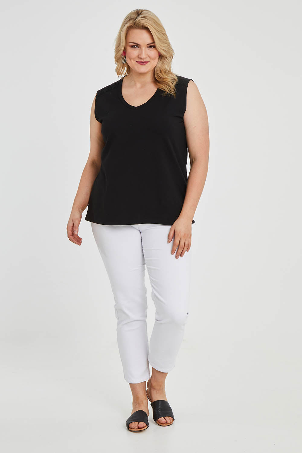 Model Keeara wearing size 16 of The Lace Insert Tank in colour Black (Black), from the front, showing the whole outfit